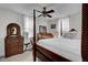 Cozy bedroom with a four-poster bed, ceiling fan, and antique wooden furniture at 2530 Jasper Blvd, Sullivans Island, SC 29482