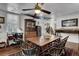 Open-concept dining room with painted ceilings, work station, and hardwood floors at 2530 Jasper Blvd, Sullivans Island, SC 29482