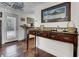 Charming entryway with rich wood floors, decorative console table, and stylish nautical accents at 2530 Jasper Blvd, Sullivans Island, SC 29482
