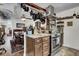 Cozy kitchen offering stainless steel appliances, pot rack, and open dining area at 2530 Jasper Blvd, Sullivans Island, SC 29482