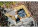A bird's eye view of a house and detached garage, focusing on the roof and landscaped grounds surrounding the property at 2725 Starfish Dr, Johns Island, SC 29455