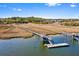 Picturesque aerial shot of waterfront homes with private docks and marshland at 2725 Starfish Dr, Johns Island, SC 29455
