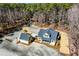 Expansive aerial view of a modern home featuring a matching detached garage and lush surrounding trees at 2725 Starfish Dr, Johns Island, SC 29455