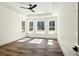 Bright bedroom with large windows, a ceiling fan, and hardwood floors at 2725 Starfish Dr, Johns Island, SC 29455