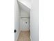 Hallway closet with neutral carpet, white shelving, and unique angled ceiling at 2725 Starfish Dr, Johns Island, SC 29455