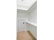 Walk-in closet featuring neutral carpet, built-in shelving, and a door to additional storage space at 2725 Starfish Dr, Johns Island, SC 29455