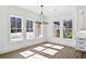 Bright dining room with recessed lighting, chandelier, and large windows overlooking the yard at 2725 Starfish Dr, Johns Island, SC 29455