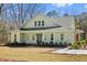 Inviting home featuring a welcoming porch, pristine lawn, and stylish architectural details for curb appeal at 2725 Starfish Dr, Johns Island, SC 29455