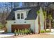 Close up exterior of the garage with finished guest suite and wooden door at 2725 Starfish Dr, Johns Island, SC 29455