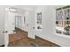 Hallway with hardwood floors connecting to rooms with ample natural light at 2725 Starfish Dr, Johns Island, SC 29455