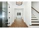 Hallway with brick floors and stairs leading to a room filled with natural light at 2725 Starfish Dr, Johns Island, SC 29455