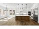 Spacious kitchen features white cabinets, stainless steel appliances, marble countertops, and eat in area at 2725 Starfish Dr, Johns Island, SC 29455