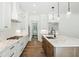 Spacious kitchen features white cabinets, stainless steel appliances, and marble countertops at 2725 Starfish Dr, Johns Island, SC 29455