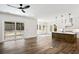 An open-concept living space leads to a modern kitchen and outdoor living area at 2725 Starfish Dr, Johns Island, SC 29455