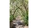 Scenic nature trail covered in leaves and shaded by trees draped with spanish moss at 2725 Starfish Dr, Johns Island, SC 29455