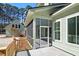 A cozy outdoor porch provides an inviting space for relaxation and entertaining at 2725 Starfish Dr, Johns Island, SC 29455
