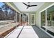 A screened porch with a ceiling fan provides a seamless transition to outdoor living at 2725 Starfish Dr, Johns Island, SC 29455