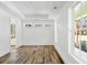 Bright, airy room with hardwood floors and white walls, complemented by multiple windows at 2725 Starfish Dr, Johns Island, SC 29455