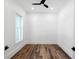 Small white room featuring hardwood floors, ceiling fan, and a single window at 2725 Starfish Dr, Johns Island, SC 29455