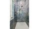 Custom tiled shower with glass enclosure and rainfall shower head at 2725 Starfish Dr, Johns Island, SC 29455