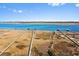 A waterfront property with a marshy area and wooden docks under a blue sky at 2725 Starfish Dr, Johns Island, SC 29455