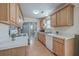 Bright kitchen featuring wooden cabinets, white countertops, and stainless steel appliances at 2755 Lacy St, North Charleston, SC 29406