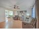 Spacious living room flowing into the dining area, with hardwood floors and a cozy ambiance at 2755 Lacy St, North Charleston, SC 29406