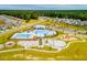 Attractive aerial view of a Gathering-friendly community pool with a splashpad and playground at 284 Watersglen Dr, Summerville, SC 29486