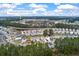 Discover the community amenity center in this overhead shot of the neighborhood and its pond at 341 Iveson Rd, Summerville, SC 29486