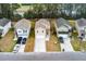 Aerial view of a single-Gathering home in a suburban neighborhood shows a well-maintained lawn and multi-car driveway at 341 Iveson Rd, Summerville, SC 29486