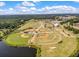 Aerial view of Cane Bay High School's baseball and athletic fields with parking and lake at 341 Iveson Rd, Summerville, SC 29486