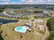 Aerial view features a neighborhood pool, clubhouse, pond, playground, and walking trails at 341 Iveson Rd, Summerville, SC 29486