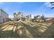 Large backyard with a trampoline, lush grass, and partial shade at 341 Iveson Rd, Summerville, SC 29486