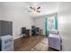 This well-lit bedroom features a ceiling fan and space for a convenient work area at 341 Iveson Rd, Summerville, SC 29486