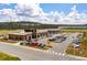 Exterior view of a modern commercial building with Buffalo Wild Wings and other businesses, surrounded by a parking lot at 341 Iveson Rd, Summerville, SC 29486