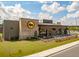 Eye-catching restaurant exterior with a brick facade, expansive windows, and an inviting outdoor patio at 341 Iveson Rd, Summerville, SC 29486