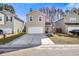 Attractive two-story home with a two-car garage, grassy lawn and cozy curb appeal at 341 Iveson Rd, Summerville, SC 29486