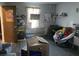 Bedroom area with wood floors, bright window, comfortable chair and storage shelves at 342 Early Ln, Summerville, SC 29486