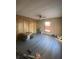 Bedroom with wood paneled walls, new floors, a window, and closet at 342 Early Ln, Summerville, SC 29486