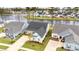 An attractive single-Gathering home is showcased with a well-manicured lawn and a serene water view in the background at 357 Tupelo Lake Dr, Summerville, SC 29486