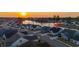 Aerial view of the home showcasing its location within a neighborhood with landscaping and water views at sunset at 357 Tupelo Lake Dr, Summerville, SC 29486