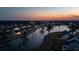 Aerial view of waterfront homes, landscaped grounds, and beautiful evening sky at 357 Tupelo Lake Dr, Summerville, SC 29486
