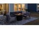 Outdoor patio with a seating area around a fire pit, screened-in porch, and stone paver patio at 357 Tupelo Lake Dr, Summerville, SC 29486