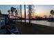 Waterfront backyard with a patio and stunning sunset views over the lake at 357 Tupelo Lake Dr, Summerville, SC 29486