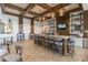 Relaxing cafe featuring a long counter with bar stools, shelves with dishware and a TV at 357 Tupelo Lake Dr, Summerville, SC 29486