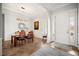 Gracious entryway featuring wood floors, crown molding, and natural light that complements the elegant dining area at 357 Tupelo Lake Dr, Summerville, SC 29486