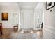 Welcoming home entryway with hardwood flooring, crown molding, and natural light from the sidelight windows at 357 Tupelo Lake Dr, Summerville, SC 29486