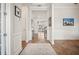 Inviting hallway with hardwood floors, decorative moldings, and an open view to the living area at 357 Tupelo Lake Dr, Summerville, SC 29486