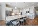 Bright kitchen with white cabinetry, stainless steel appliances, and large center island with seating at 357 Tupelo Lake Dr, Summerville, SC 29486