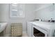 Well-organized laundry room with modern appliances, cabinet storage, and window at 357 Tupelo Lake Dr, Summerville, SC 29486